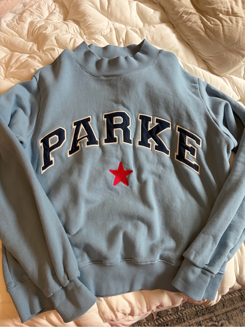 Parker Light Blue Crewneck Sweater with Red Star Applique
